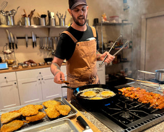 Photo of Chef Dan cooking and teaching.