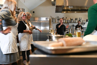 Chef Mike teaching a class behind the stovetop at The Recipe.