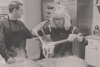 Chef mike teaching a guest to cook pasta.